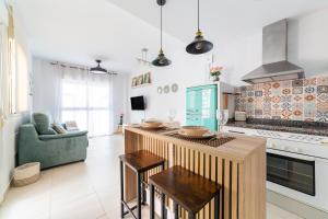 a kitchen with a island in the middle of a room at Laguna beach Vera in Vera