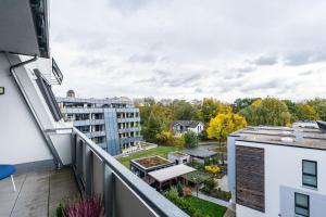 an apartment balcony with a view of a building at Studio am Schloßteich in Chemnitz