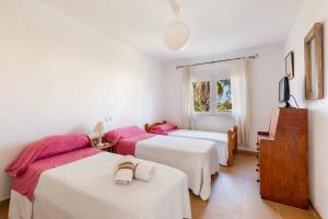 a room with two beds and a couch at La Gola in La Manga del Mar Menor +23 photos