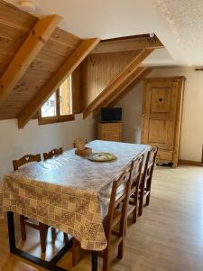 a dining room with a table and chairs at Chalet Moulinot in Valloire