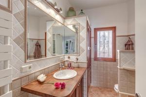 a bathroom with a sink and a mirror at Casa Paqui in Port de Soller +23 photos