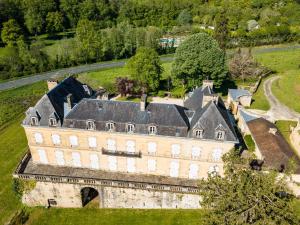 an aerial view of an old building in a field at Gite La Salamandre in Saint-André-dʼAllas