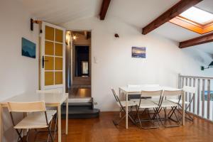 a dining room with a table and chairs at Maison Roxane in Six-Fours-les-Plages