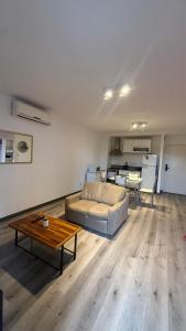 a living room with a couch and a table at 01 Tigre Stays in Tigre