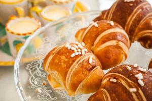 a bunch of pastries on a glass plate at Tenuta Del Poggio Antico in Ischia
