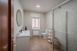 a bathroom with a sink and a toilet and a shower at Casa Tilde in Matapozuelos +16 photos