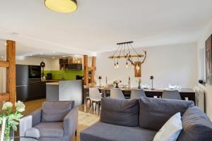 a living room and kitchen with a couch and a table at Haus Schiltach in Schramberg