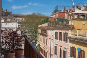 a view from a balcony of buildings at TriplyRooms Collection - Roma Colosseo in Rome