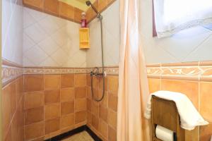a bathroom with a shower with a shower curtain at Casa Carmela in La Guancha +15 photos