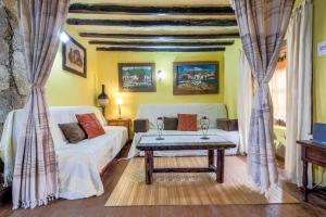 a living room with a couch and a table at Casa Carmela in La Guancha