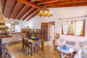 a living room with a couch and a table at Can Sito in Cala Tuent
