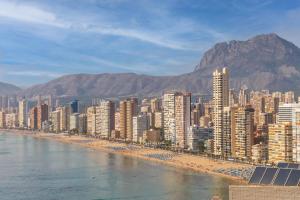 a view of a city with a beach and buildings at Don Miguel 2 in Benidorm