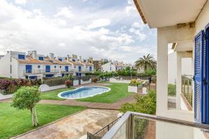 a view from the balcony of a house with a swimming pool at Oasis Premium Costa Brava in L'Estartit