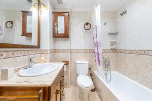 a bathroom with a sink and a toilet and a tub at La Gimena in Orihuela +17 photos