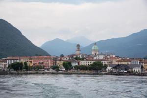 a view of a city from a body of water at La piccola Lami in Intra