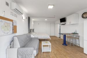 a living room with a couch and a table at Casa Lea Artenara in Artenara