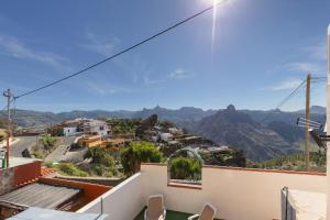 a view of the mountains from the balcony of a house at Casa Lea Artenara in Artenara
