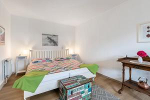 a bedroom with a bed and a table at Ferienwohnung zur Ostsee in Westerholz +27 photos