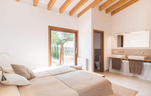 a white bedroom with a large bed and a sink at Son Sec Nou in El Palmer +19 photos
