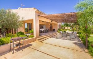an outdoor patio of a home with a table and chairs at Son Sec Nou in El Palmer