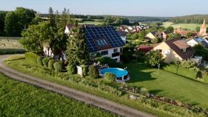 an aerial view of a house with a solar roof at Heim Lisse in Dietenhofen