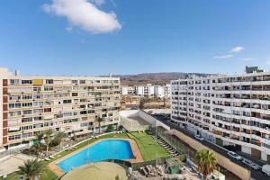 an aerial view of a large apartment building with a swimming pool at Los Molinos 735 in Maspalomas