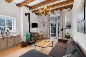 a living room with a couch and a table at Altes Forstamt in Gernsbach