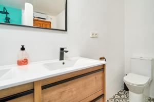 a bathroom with a sink and a toilet at Lily in Almuñécar +27 photos