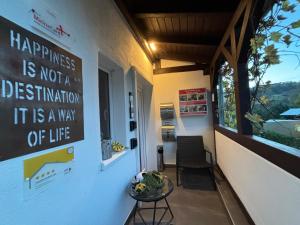 a room with a table and a sign on the wall at Kleiner Kalle in Melsungen
