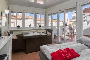 a living room with a bed and a view of a balcony at Casa Cox Laguna Beach Torrox Costa in Torrox Costa