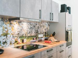 a kitchen with a counter with fruits and vegetables on it at Ferienwohnung 12 Kirschen in Durbach