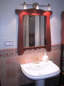 a bathroom with a sink and a mirror at Casa Bohemio - Tabarca in Tabarca +30 photos