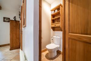 a small bathroom with a toilet in a room at Appart Cosy 3 étoiles in Arâches-la-Frasse +22 photos