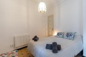 a bedroom with a bed with two towels on it at Casa Blanca in Estepona