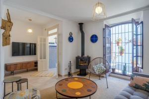 a living room with a couch and a table at Casa Blanca in Estepona
