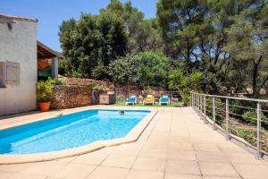 a swimming pool in the backyard of a house at La Maison Méditerranéenne in La Ciotat