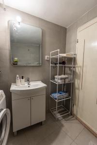 a bathroom with a sink and a mirror at Old street 2 in Podgorica +26 photos