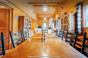 a dining room with a long table and chairs at Chalet Chocolat - 10 pers - Châtel in Châtel
