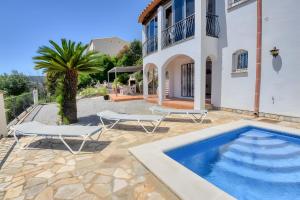 a villa with a swimming pool and a house at Villa Romantica by Easy Brava in Calonge