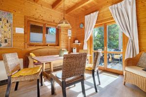 a dining room with a table and chairs at Haus Reiher in Lychen