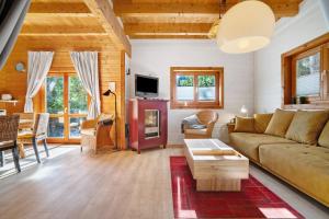 a living room with a couch and a table at Haus Reiher in Lychen