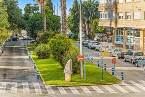 a street with cars parked on the side of a road at Unique hotel apartment 1-2 in Torrevieja +12 photos