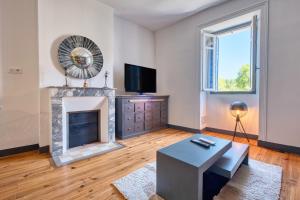 TV a/nebo společenská místnost v ubytování Appartement 4 pers, climatisé