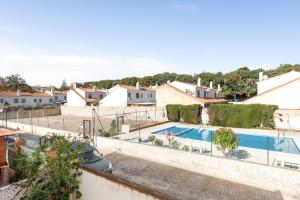 a house with a swimming pool in a yard at La Casa de la Cala del Moral in Cala del Moral