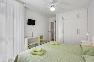a bedroom with a bed with two pillows on it at Casa Médano 18 in Granadilla de Abona