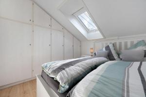 a bedroom with a bed and a skylight at Ferienwohnung Kraft in Bad Wildbad