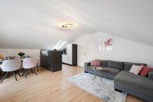 a living room with a couch and a table at Ferienwohnung Kraft in Bad Wildbad