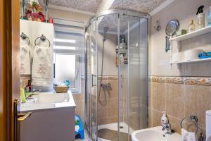 a bathroom with a shower and a sink at Rincón De Julia in Gijón +14 photos