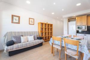 a living room with a couch and a table at Mont Pele in Cullera
