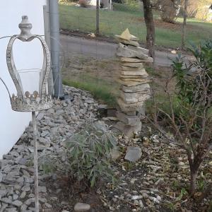 a stack of rocks next to a street light at Grimm's Lodge in Lörrach